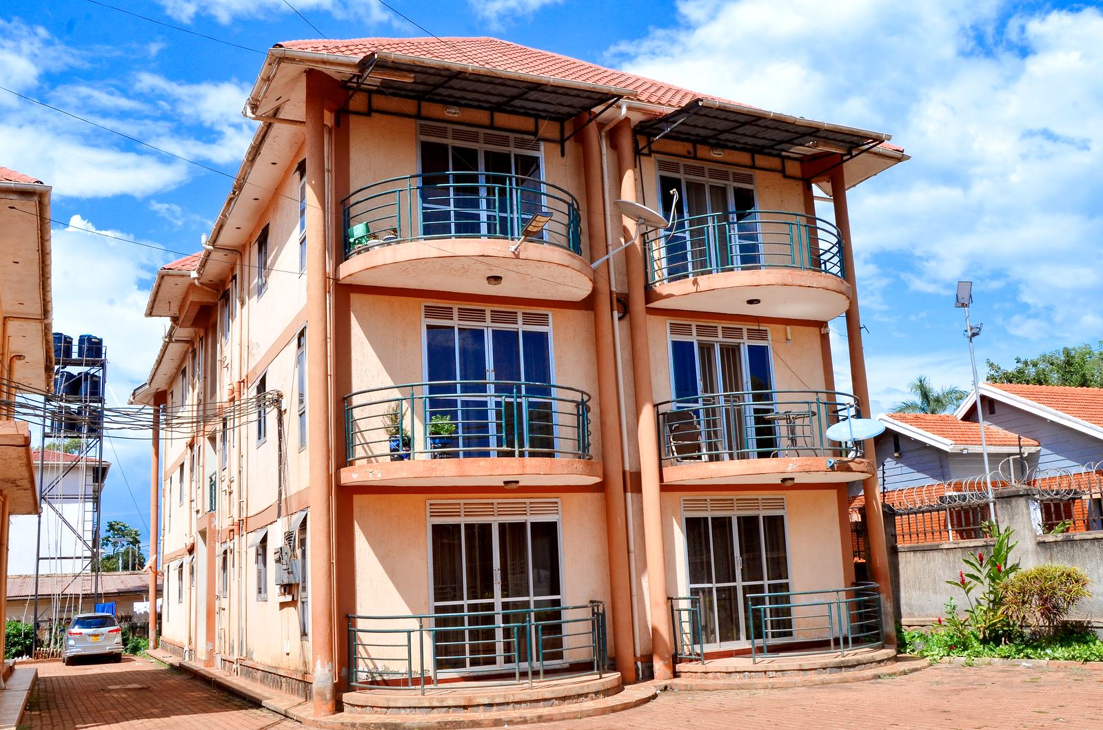 Apartment block in Jinja under a blue sky