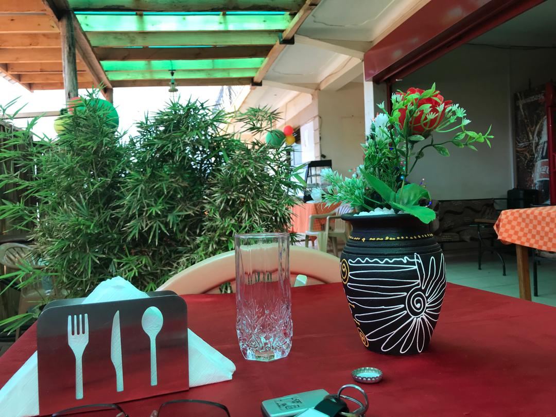 Set table on the restaurant terrace among plants